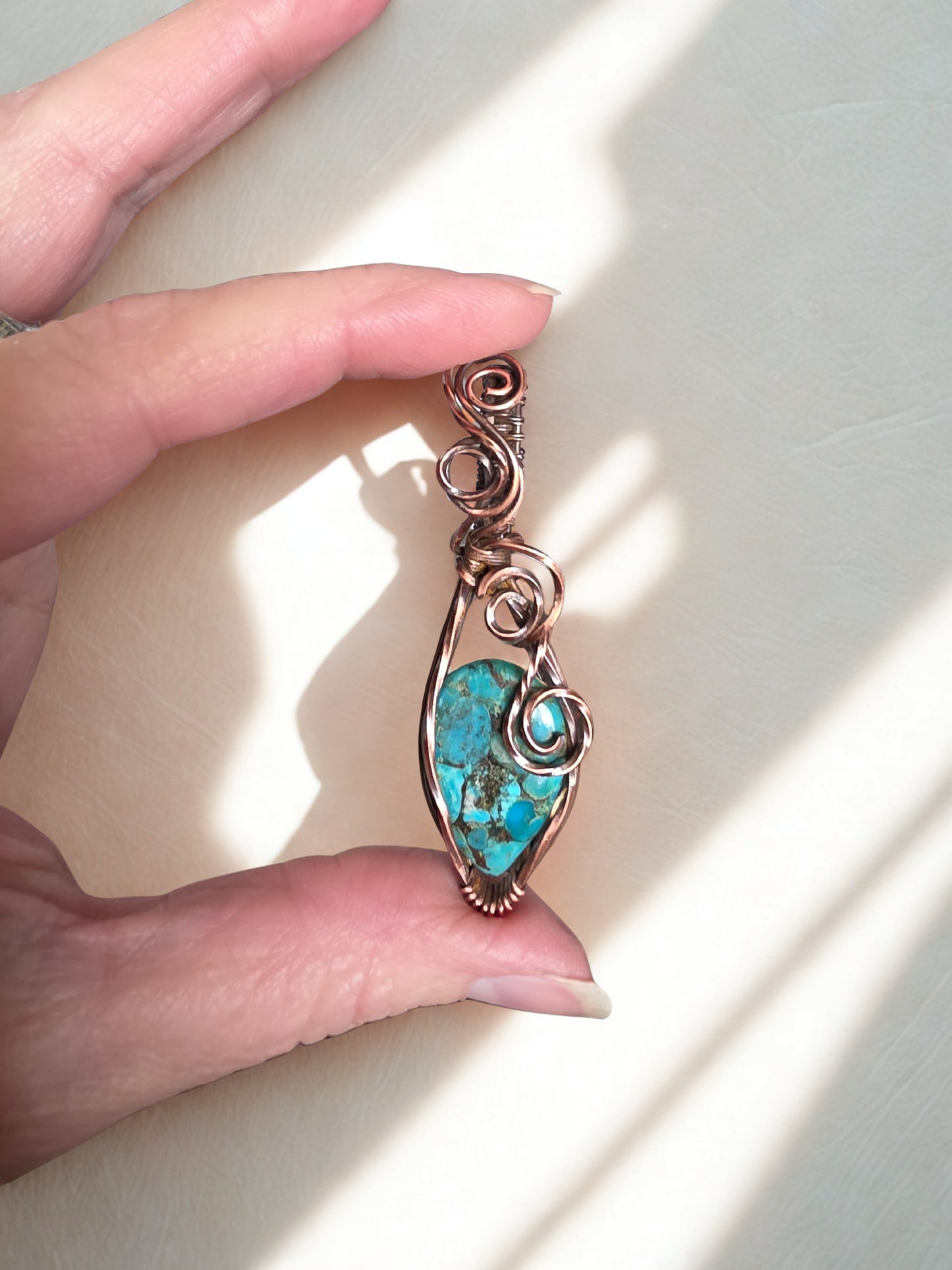 Handcrafted genuine Turquoise/ copper wire wrapped pendant.