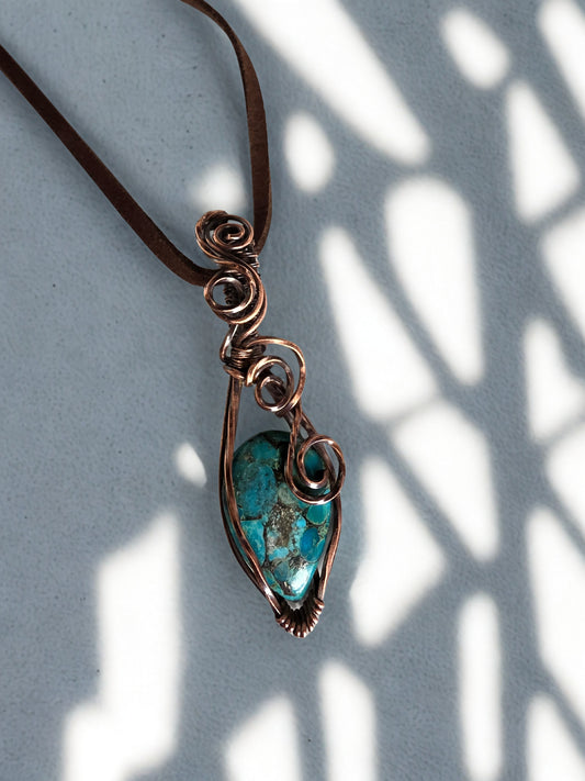 Handcrafted genuine Turquoise/ copper wire wrapped pendant.